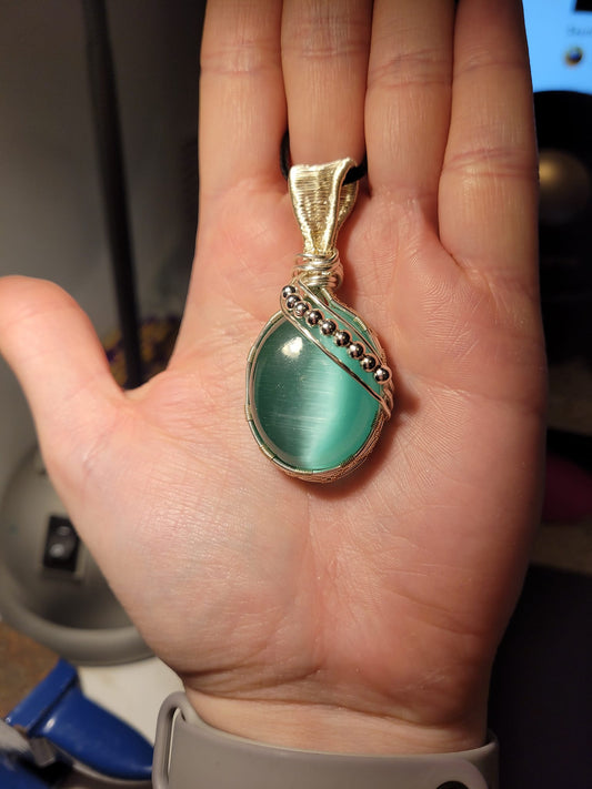 Pendentif tissé Chrysobéryl (oeil de chat) turquoise